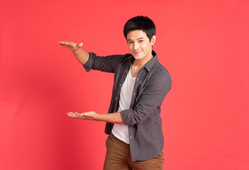 young man welcome hand on red background © mkitina4
