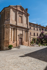 Obraz premium HIstorical center of Corinaldo with stone houses, chucrh, steps and flowers