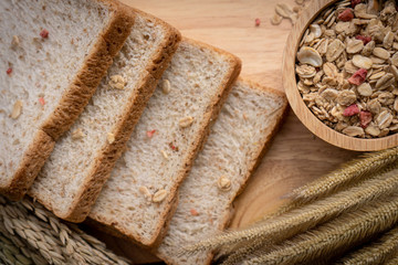 Homemade whole wheat bread, beautifully decorated on a wooden chopping board