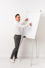 Young coach latin man with a whiteboard