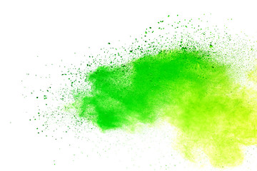 Green and yellow powder explosion on white background.