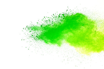 Green and yellow powder explosion on white background.