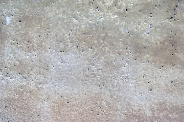 Grey old surface of asphalt and concrete wall