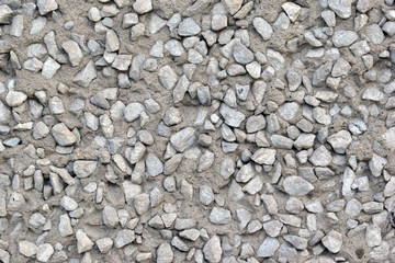 Grey old surface of asphalt and concrete wall