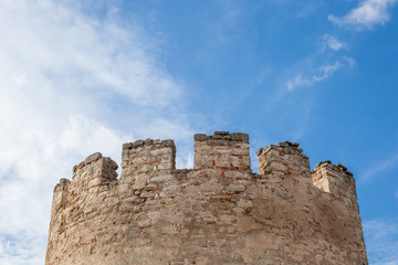 Ancient tower of stone against the sky