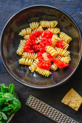 pasta rotini tomato sauce (vegetarian dish, Italian cuisine) menu concept. background. top view. copy space