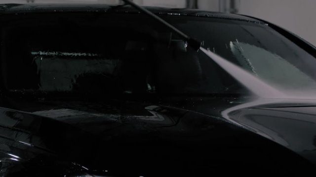 black washes with a pressure washer