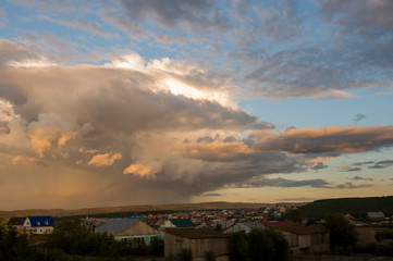 Dark blue grey sky with much rainy clouds before storm.  Background of heaven. Beautiful evening