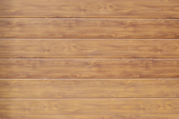 Obraz na płótnie Canvas Horizontal wooden planks of brown color as a background.