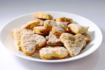 Concept business crisis, angry young businessman in horror clutching his head, in the background is a stock chart with a negative trend.