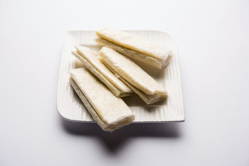 Pootharekulu  is a popular recipe originated from Andhra Pradesh, India.It is a paper-thin sweet or dessert made from rice start/gram flour, jaggery/sugar and clarified butter. Served in a plate.