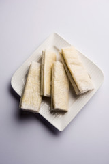 Pootharekulu  is a popular recipe originated from Andhra Pradesh, India.It is a paper-thin sweet or dessert made from rice start/gram flour, jaggery/sugar and clarified butter. Served in a plate.