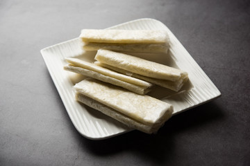 Pootharekulu  is a popular recipe originated from Andhra Pradesh, India.It is a paper-thin sweet or dessert made from rice start/gram flour, jaggery/sugar and clarified butter. Served in a plate.