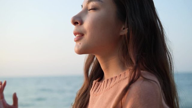 Asian teenage girl travel to sea at seaside in beach summer. Young female happy relax with nature. Young women medication nature therapy.
