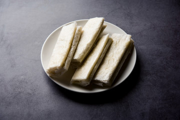 Pootharekulu  is a popular recipe originated from Andhra Pradesh, India.It is a paper-thin sweet or dessert made from rice start/gram flour, jaggery/sugar and clarified butter. Served in a plate.