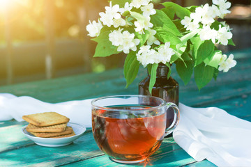 Jasmine tea with jasmine herb flower on wooden table