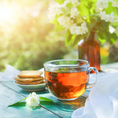 Jasmine tea with jasmine herb flower on wooden table