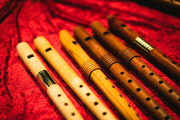 Early Music Historical Instrument - Six Baroque Recorders with a red background