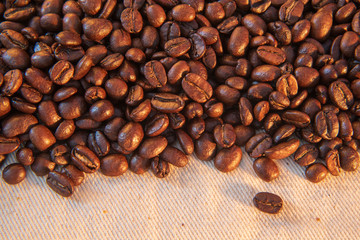 coffee beans on burlap background