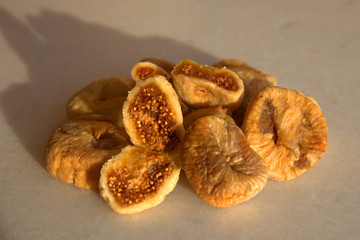 Dried figs and apricots on white background 