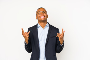 Young business latin man isolated on white background showing rock gesture with fingers