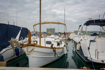 Fototapeta premium Boat in Comarruga harbor, Tarragona, Catalonia, Spain.