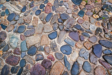 Paved road / cobblestone-covered street made of colourful cobblestones