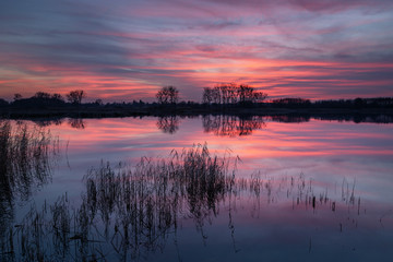 Wonderful colorful clouds over the lake after sunset, calm and beauty nature