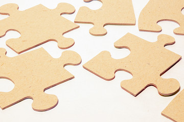 paper puzzles on a white background