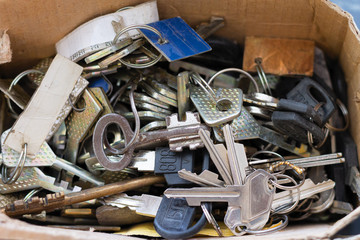 A bunch of different lock keys randomly lying in a heap.