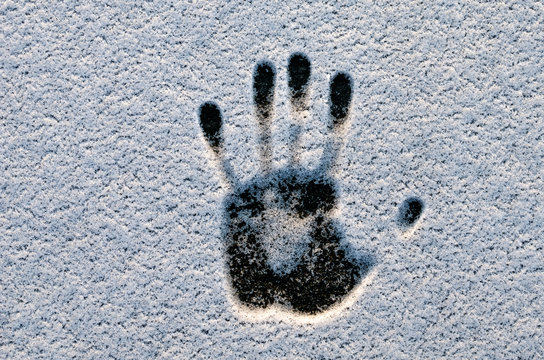 Handprint In The Snow. The Effect Of Human Heat On Snow. Hand Print In Snow