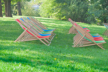 Red, Green and Blue coloured Folded Deck Chairs