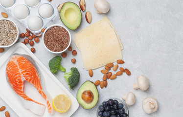 Ketogenic food ingredients. Keto diet concept. Balanced food background. Vegetables, fish, cheese, eggs and nuts. 