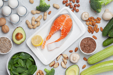 Ketogenic food ingredients. Keto diet concept. Balanced food background. Vegetables, fish, cheese, eggs and nuts. 