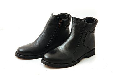 Pair of leather men's shoes isolated on white background