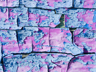 Abstract background from pink and blue exfoliating paints with multi-layered effect