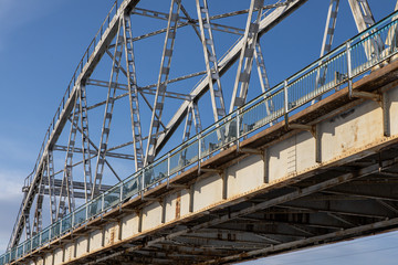 Steel bridge frame close. Bridge over the winter river