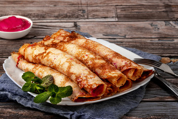 Pancakes with beetroot and cheese pasta and salmon