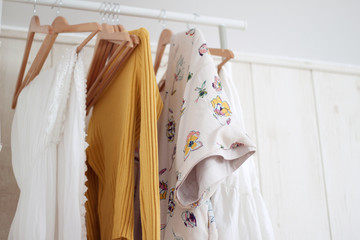 clothesline with clothes in white room