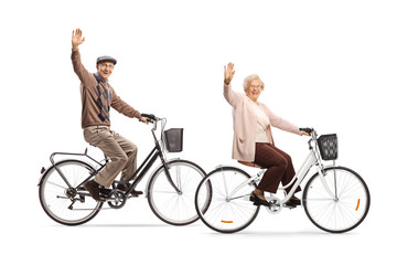 Seniors riding bicycles and waving at the camera