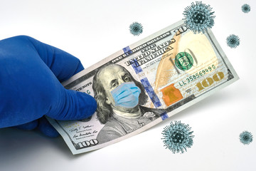 Cash is a 100-dollar bill with a face mask. Coronavirus affects the global stock market. The global...