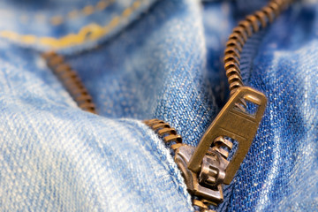 Open zipper of a worn out jeans © manfredxy