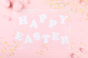 Happy Easter Greeting card with the inscription on a pink paper background.Concept of festive greetings
