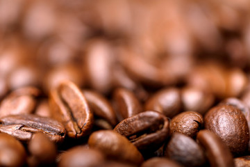 Close up macro a group roasted brown or black coffee grains background. Close up coffee beans.