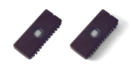 Macro photo of a vintage CMOS EPROM microchip with a glass window isolated on a white background with shadow and without.