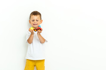 Cute little boy playing with a toy