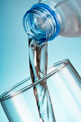 water flowing from bottle to glass
