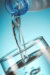 water flowing from bottle to glass