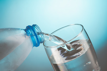 water flowing from bottle to glass