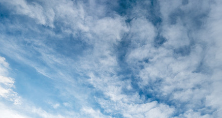 Backgrounds and textures. Blue beautiful sky with clouds.